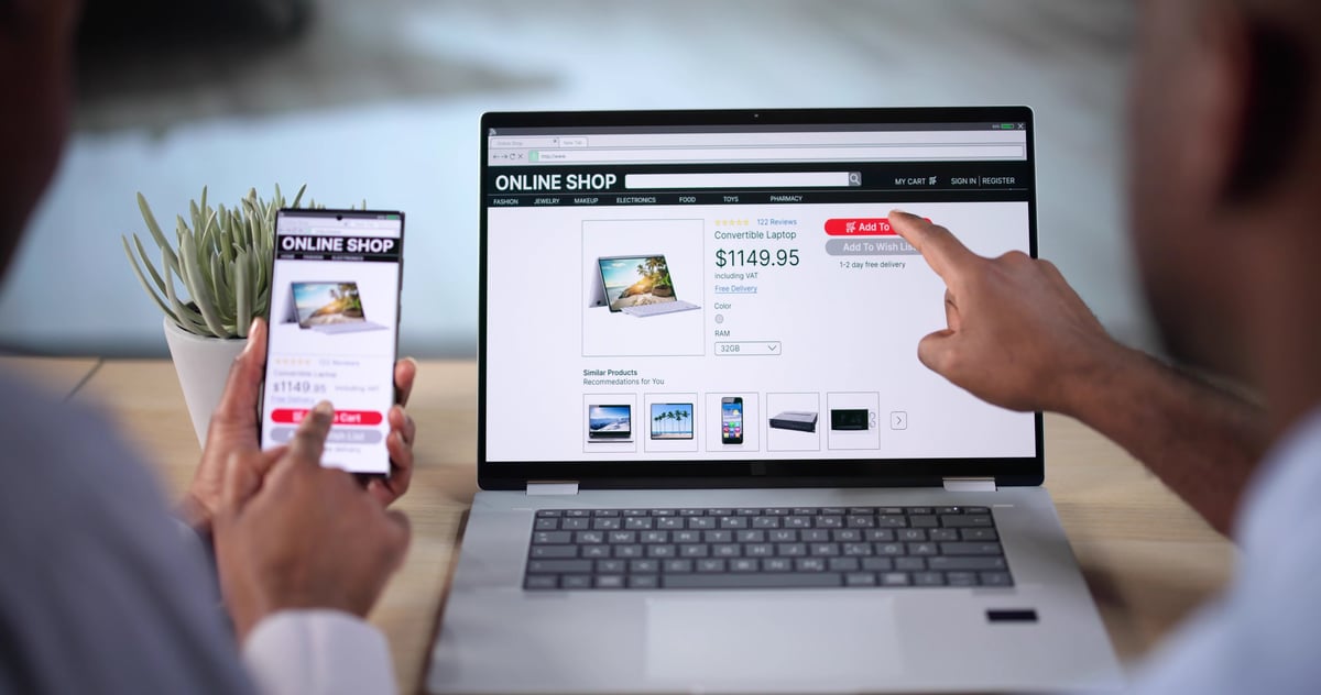 Person viewing a business website on a phone, where most Google Ads clicks land.