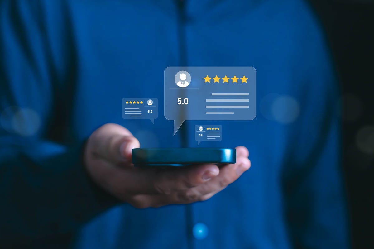 Customer leaving a five-star review on a phone.
