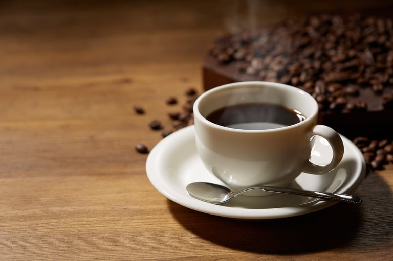 Cup of coffee with grains on wooden background, representing measuring marketing returns carefully.