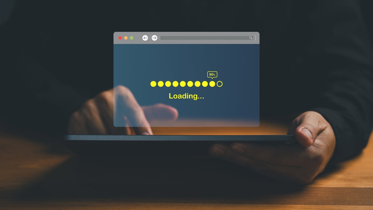 Person waiting for a slow website to load on a phone, tempted to leave.
