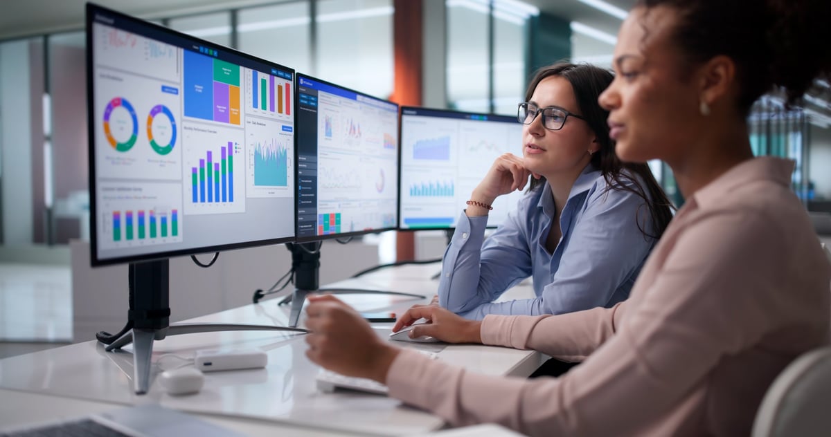 Analytics team reviewing marketing ROI charts and financial reports in an office, measuring digital marketing return on investment