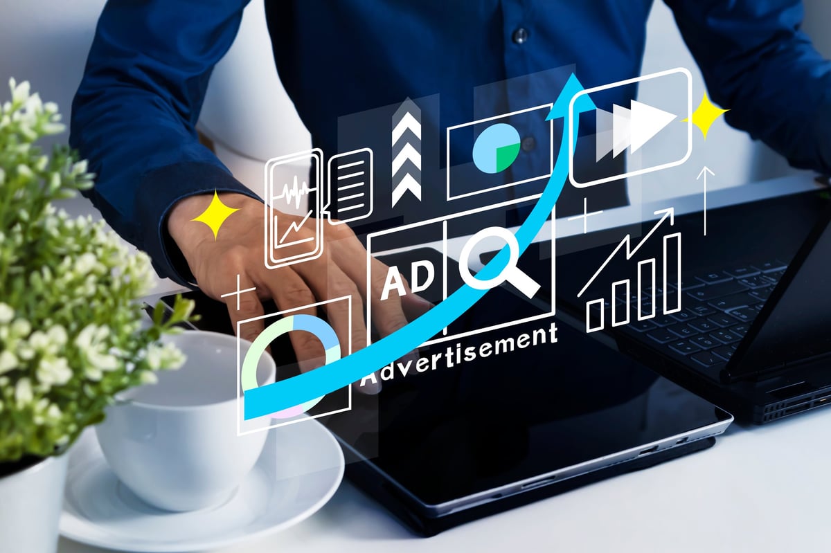 Business owner reviewing a Google Ads budget and cost-per-click figures on a laptop