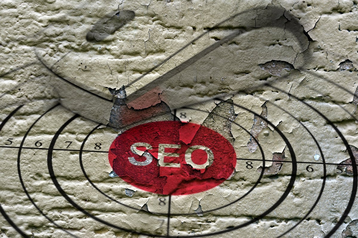 SEO target grunge concept graphic representing the debate over whether SEO is dead in 2026.