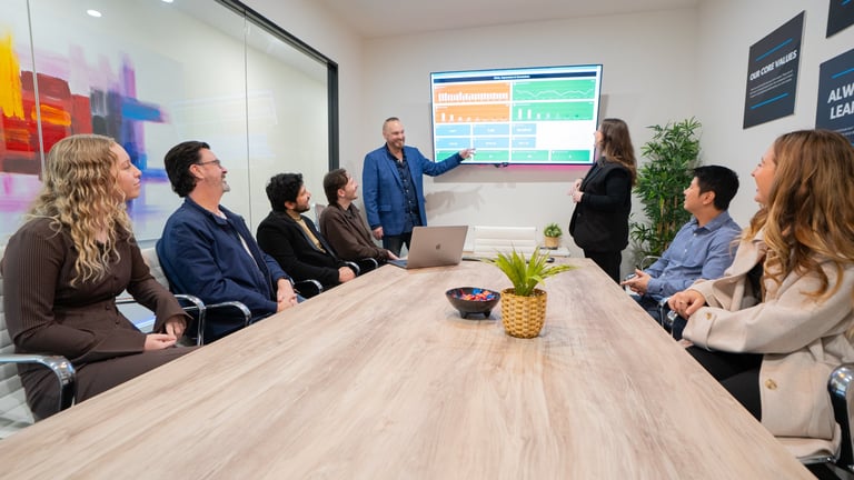 Digital Marketing Adelaide team walking a client through their live performance dashboard